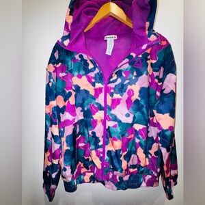 Reebok women’s lightweight hooded zip jacket Abstract design Mesh lining Medium